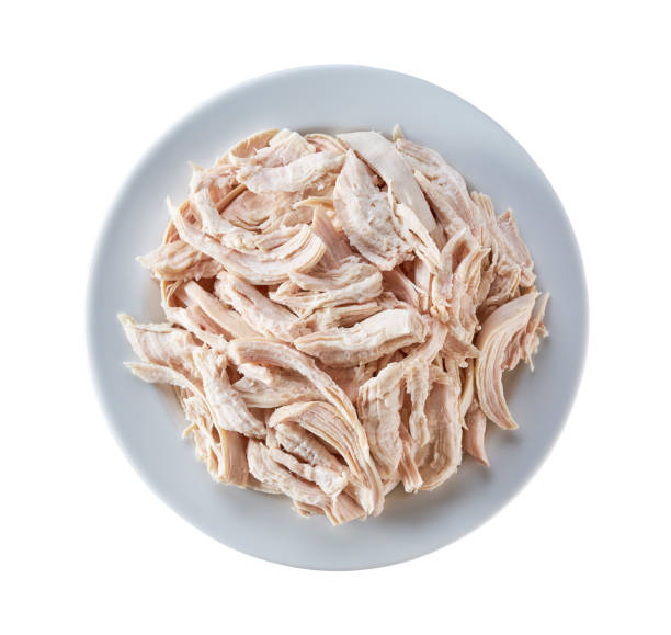 istock Boiled shredded chicken meat in a ceramic plate isolated on a white background. Top view. 1739039025