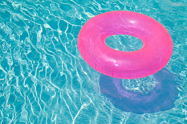 istock Pink Inner Tube in Swimming Pool 173904044