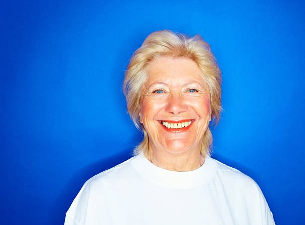 istock Beautiful old woman isolated against blue 173904772
