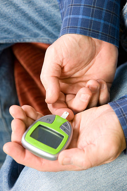 Man Using Glucometer 1,900+ Man Measuring Blood Sugar Stock Photos, Pictures & Royalty-Free ...
