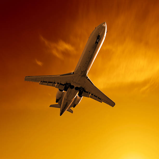 istock XL corporate jet airplane landing at sunset 173904839