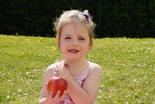 istock young girl and apple 173905036