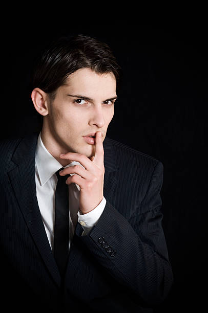 istock Young businessman aks for silence 173905172