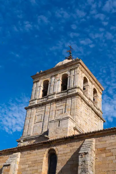 Aguilar de Campoo church tower of St. Michael the Archangel in the town square Palencia, Castilla y León, Spain.