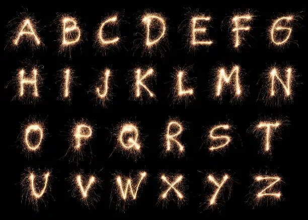 The alphabet made with sparklers.New Year