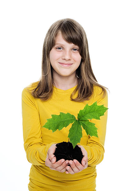 istock Girl With Seedling In Her Hands 173905688