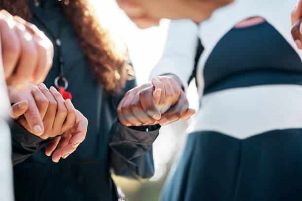 istock Cheerleader support, people holding hands and group prayer circle, community and hope for sports competition solidarity. Cheerleading teamwork, worship and closeup dancer praying for performance 1739057151