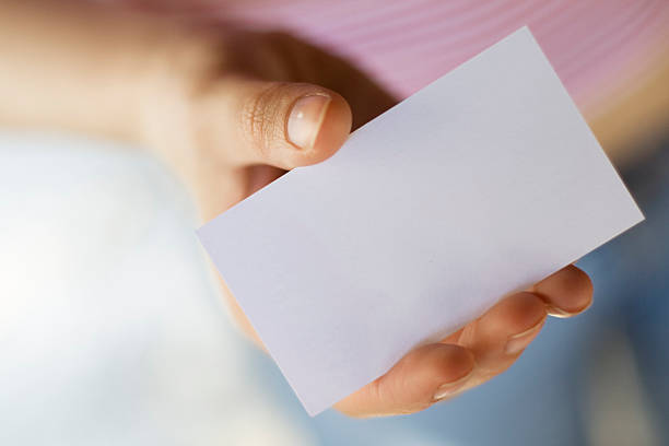 Hand with Blank Business Card stock photo