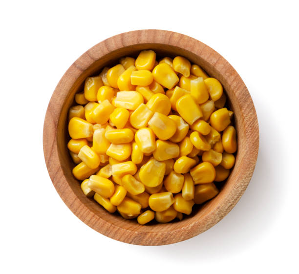 istock Canned corn in a wooden plate on a white background. Top view 1739062922