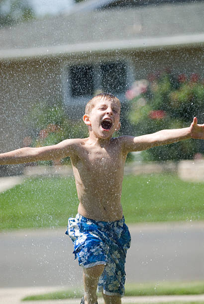 istock Summer Fun in the Sprinkler 173906564