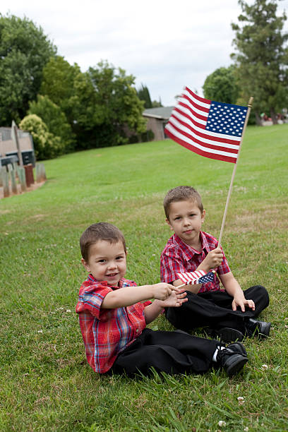 istock Two boys waving USA flags 173906795