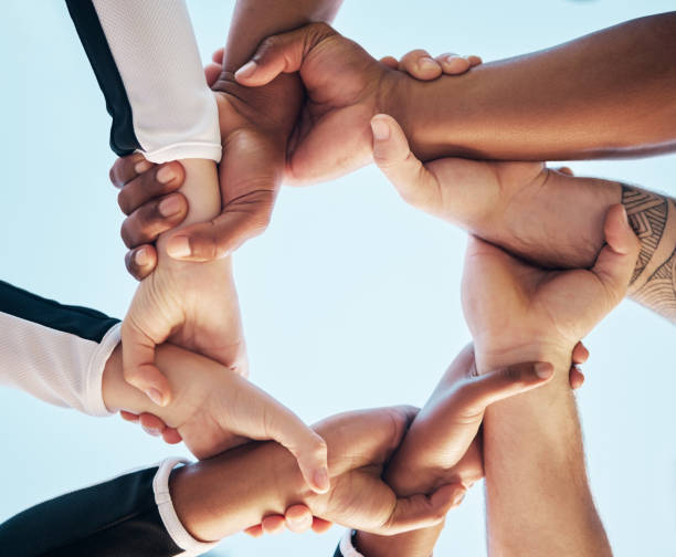 istock Hands, link or chain with people on team, collaboration and solidarity with support and connection low angle. Community, synergy and huddle with mission in group, meeting and communication of goals 1739069720