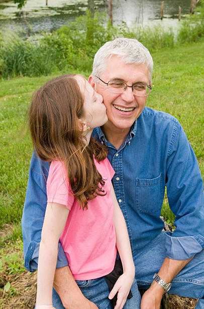 istock Grandaughter kissing Grandpa 173907168