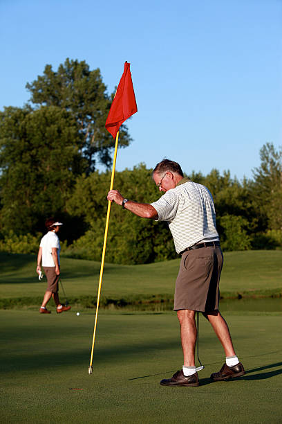 istock Senior Couple Playing Golf on Putting Green 173907193