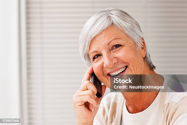 Smiling Senior Woman Talking On Cellphone Stock Photo - Download Image Now - 60-64 Years, 60-69 Years, Active Seniors