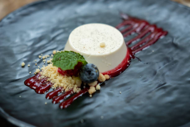 istock Panna Cotta served on plate with berries and sauce 1739077547