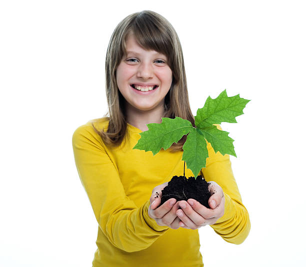 istock Girl With Seedling In Her Hands 173908159