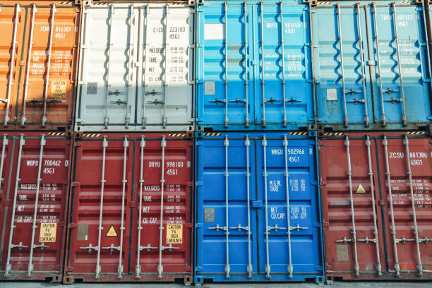 istock Background of Shipping Containers in a Harbor Terminal 1739081696
