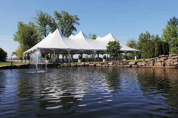 Celebration Tent and Backyard Pond  knot garden stock pictures, royalty-free photos & images