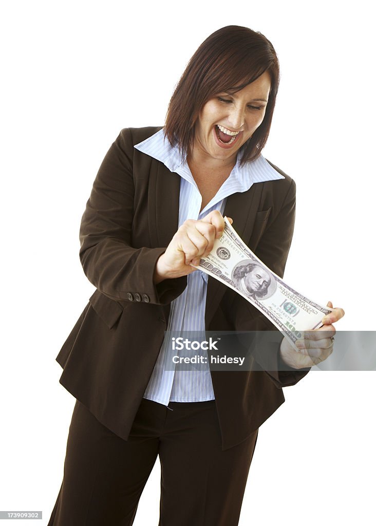 Better Budgeting "Attractive brunette business woman pulling money.  Signifying budgeting, making your money go further etc. Isolated on a white background" 20-29 Years Stock Photo