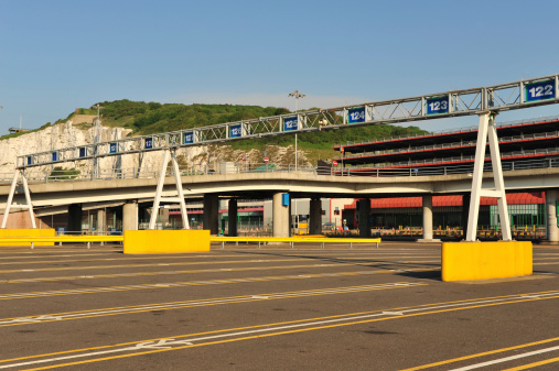 Traffic lanes at The Port of Dover ferry terminal, UK,  The White Cliffs of Dover form a stunning backdrop to the port.