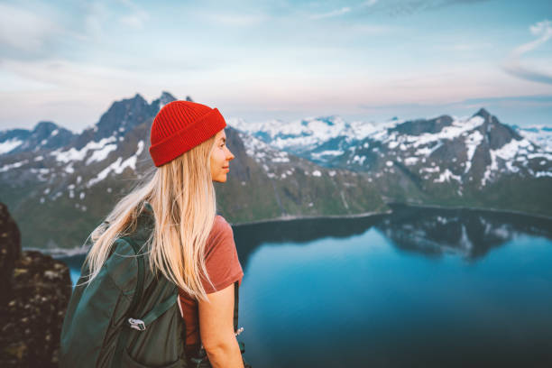 istock Woman hiker exploring Norway with backpack active healthy lifestyle mountains adventures travel vacations eco tourism on Senja island 1739102253