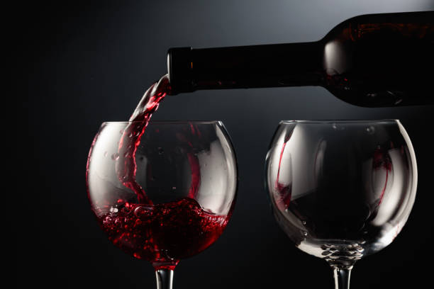 istock Pouring red wine into a wine glass. 1739103955