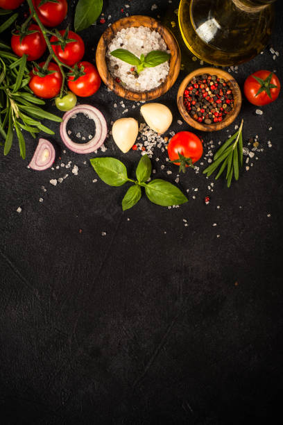 istock Food cooking background at black top view. 1739105095