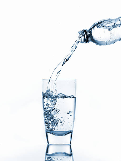 Pouring glass of water