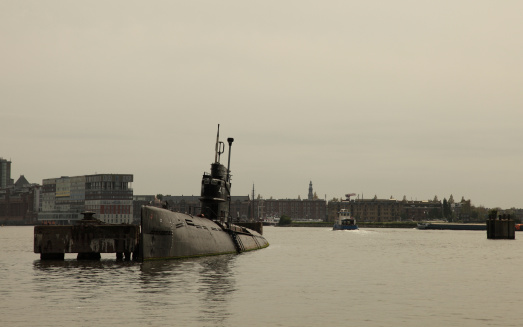 A US Navy submarine enters the breakwater at the harbor in San Diego, California.