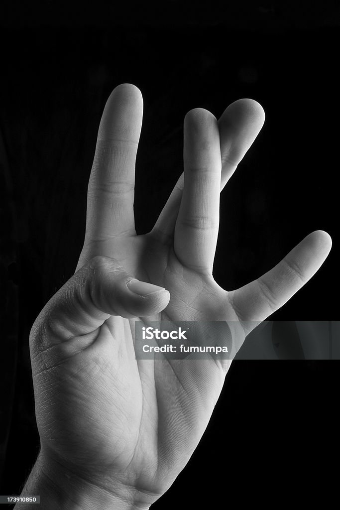 human hand , gesturing "human hand on black background , gesturing W sign" Letter W Stock Photo