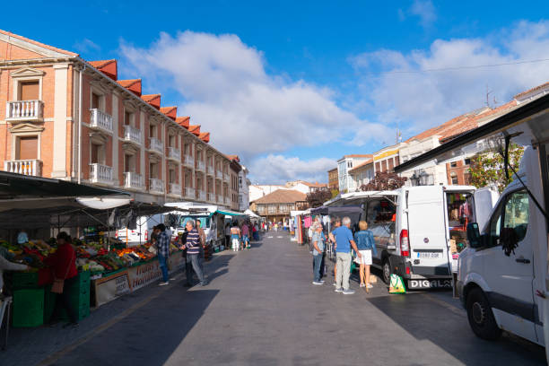 street market with stalls and people aguilar de campoo, palencia province in castile and león, spain - palencia province imagens e fotografias de stock