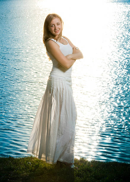 istock Young beautiful smiling woman at sunset 173911613