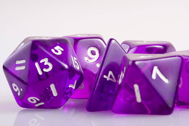 Purple says "Purple dice, used in role playing games." developing 8 stock pictures, royalty-free photos & images