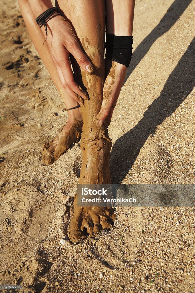 feet and hands Treatment by a dirt in Israel.female feet and hands. Adult Stock Photo