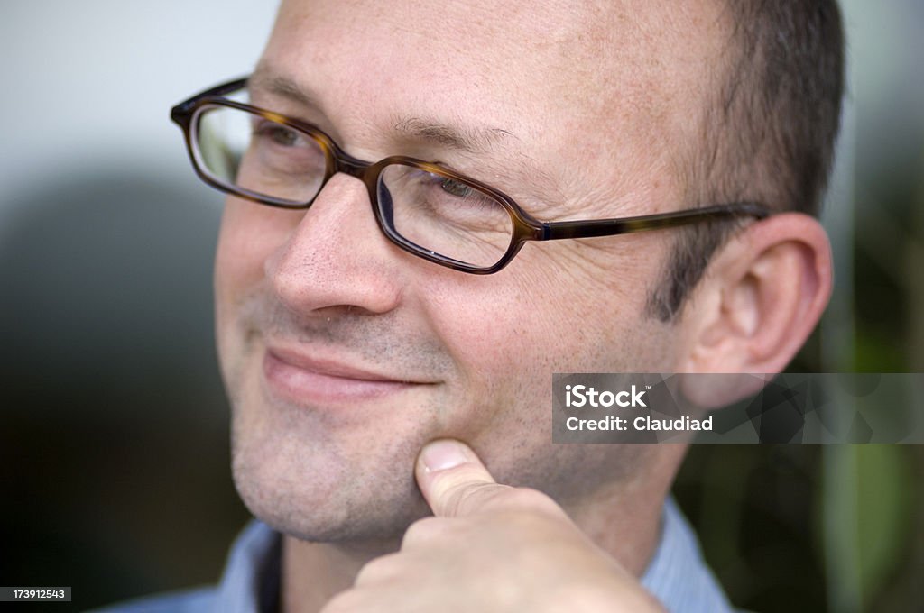 Man with glasses "Cheerful man, 45 years old.More of that model and similar pics:" Adult Stock Photo