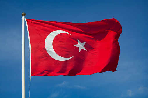 The flag of Turkey waving in the wind.