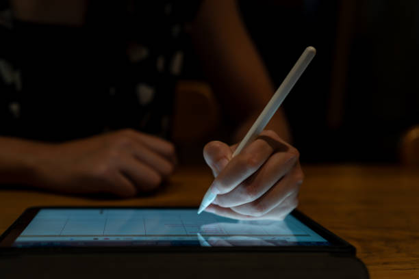 istock closeup Make a note of and drawing learning on tablet computer and doing homework in classroom,back to school 1739130081