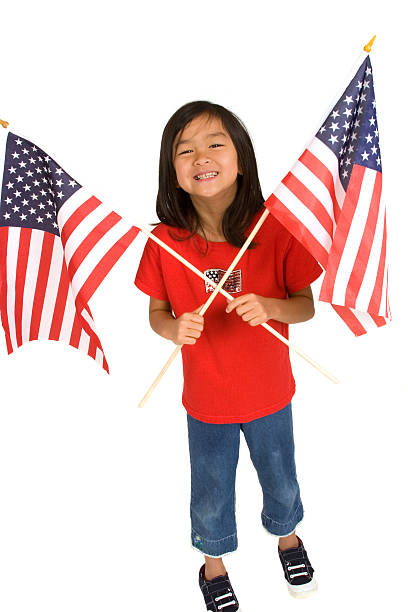 istock Chinese girl holding American Flags 173913070