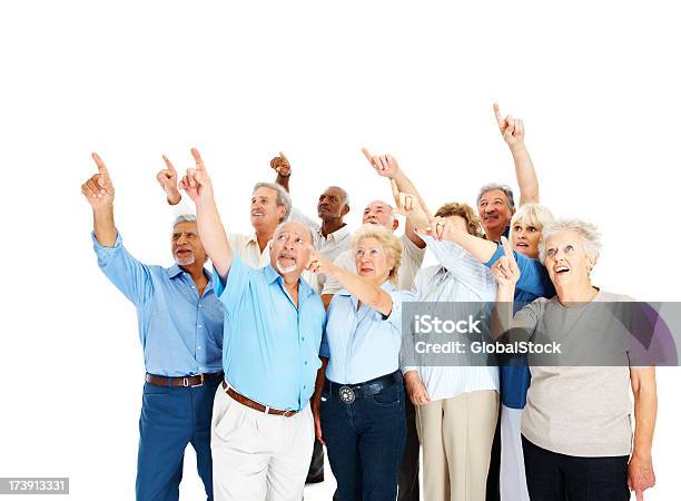 Group Of Senior Men And Women Pointing Upwards Stock Photo - Download Image Now - 60-69 Years, 65-69 Years, 70-79 Years