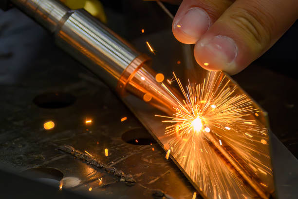 istock Close up scene the laser welding process with the sparking light. 1739137239