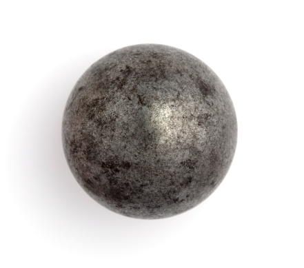 Worn steel ball bearing isolated on a white background. Would also work as a steely marble.
