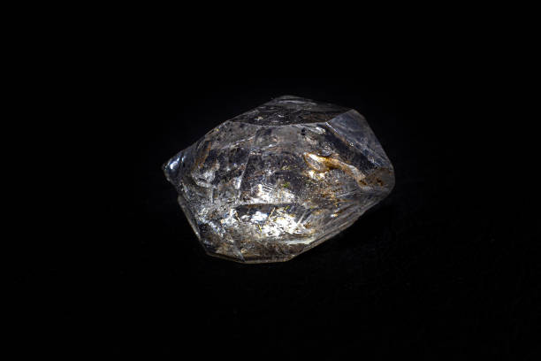 istock Real natural shaped double-terminated clear quartz Herkimer diamond crystal macro isolated on a black surface background 1739142365