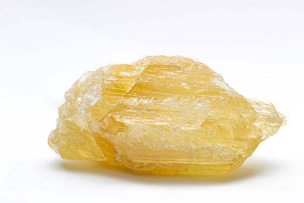 istock Raw uncut real honey yellow calcite crystal, calcium carbonate mineral with visible structure macro isolated on a white background surface 1739144182