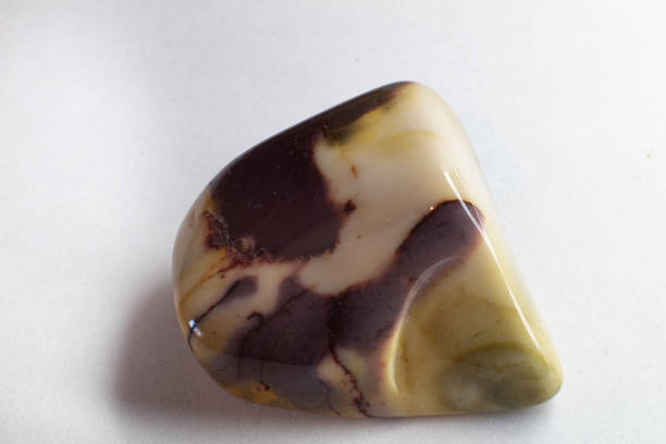 istock Macro photography of Mookaite jasper on white surface. Chocolate like crystal. 1739146148