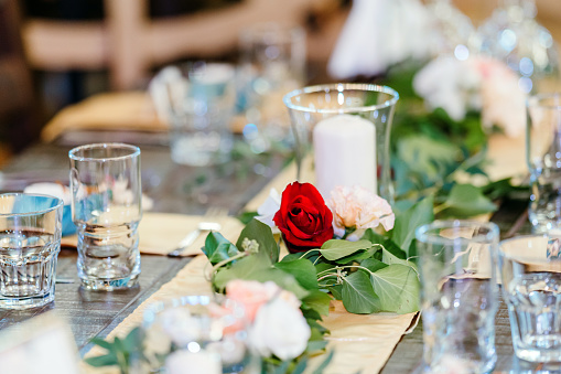 Wedding table decorated with red rose