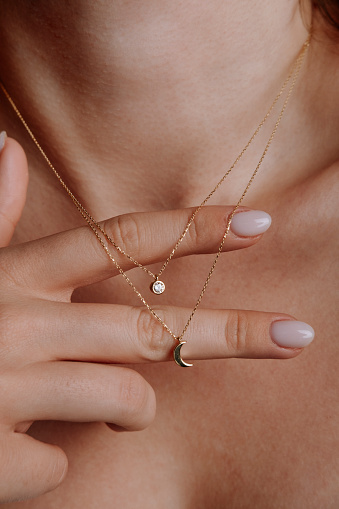 stylish elegant gold necklace on young girl's neck