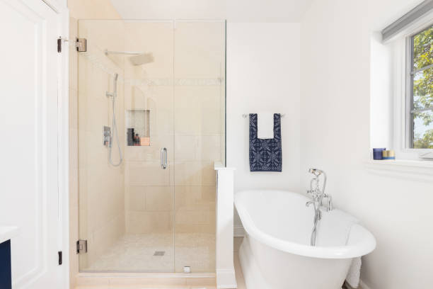 istock A bathroom's walk-in shower and free standing soaking tub. 1739158070