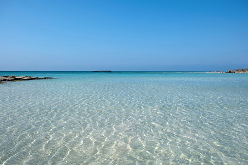 Elafonisi beach, Crete island Greece. Pink sand, shallow calm water, famous summer destination.