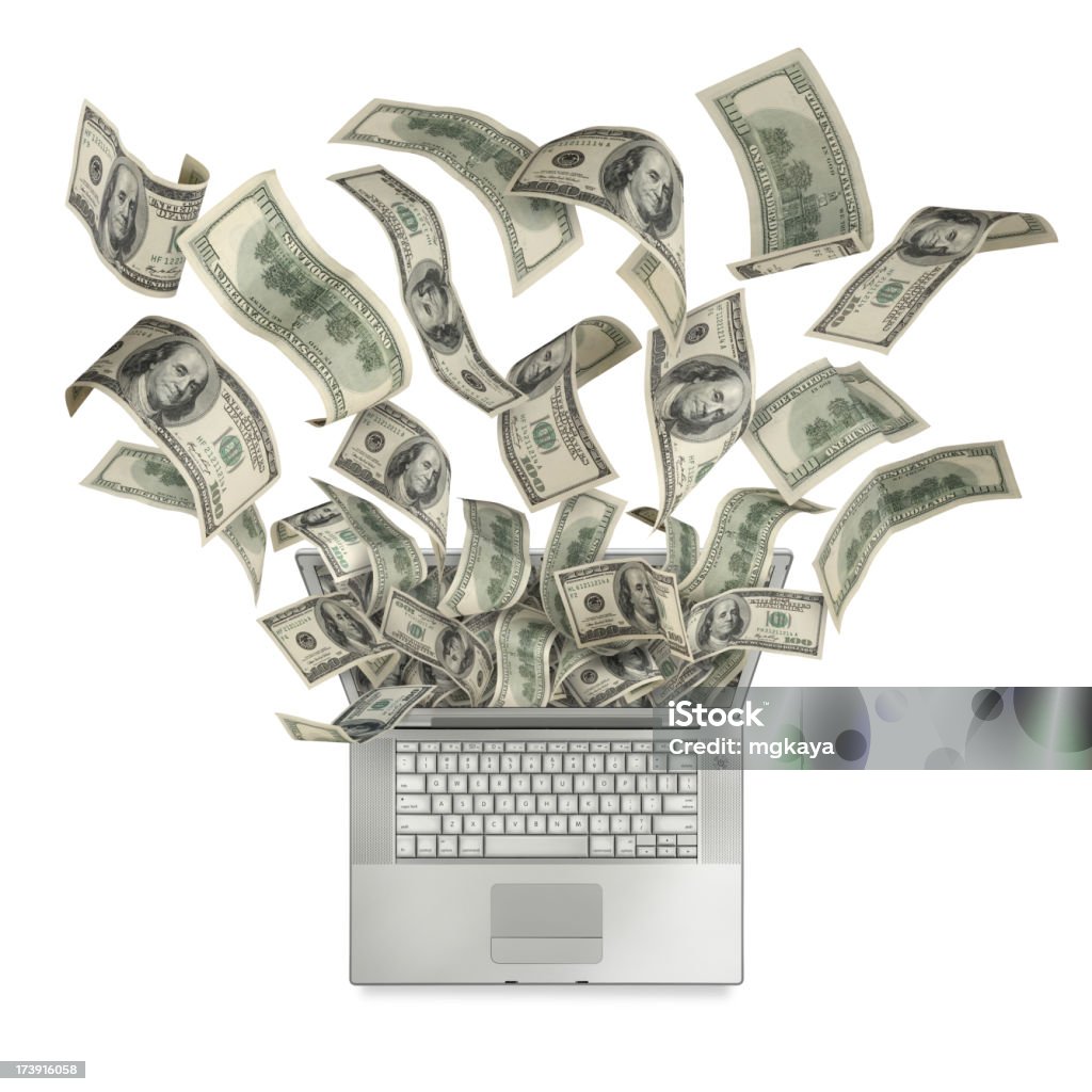 Cash Flow With Computer Cash (one hundred-dollar bills) flowing in and out of a portable computer (laptop) screen. Top view and isolated on white background. Computer Stock Photo